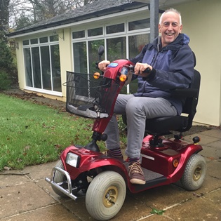 Image of John on a mobility scooter